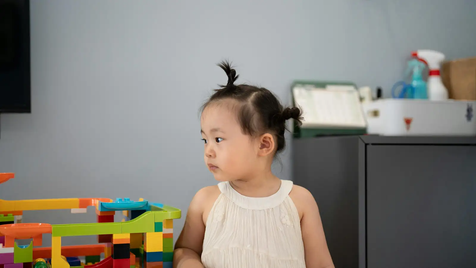Toddler building with blocks