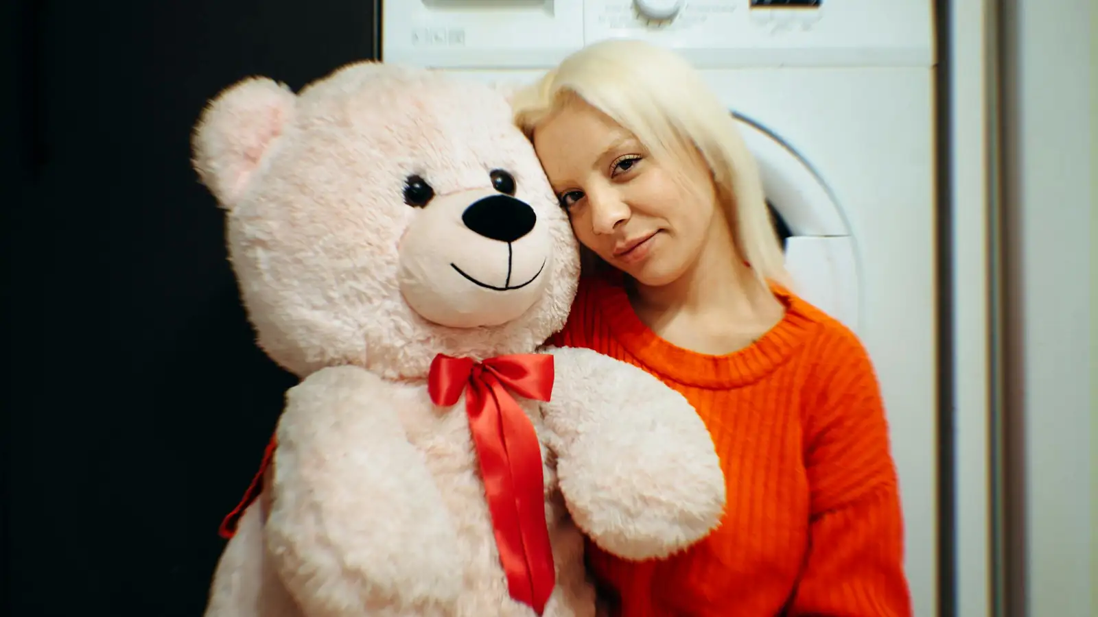 Cheerful grandmother with a toy