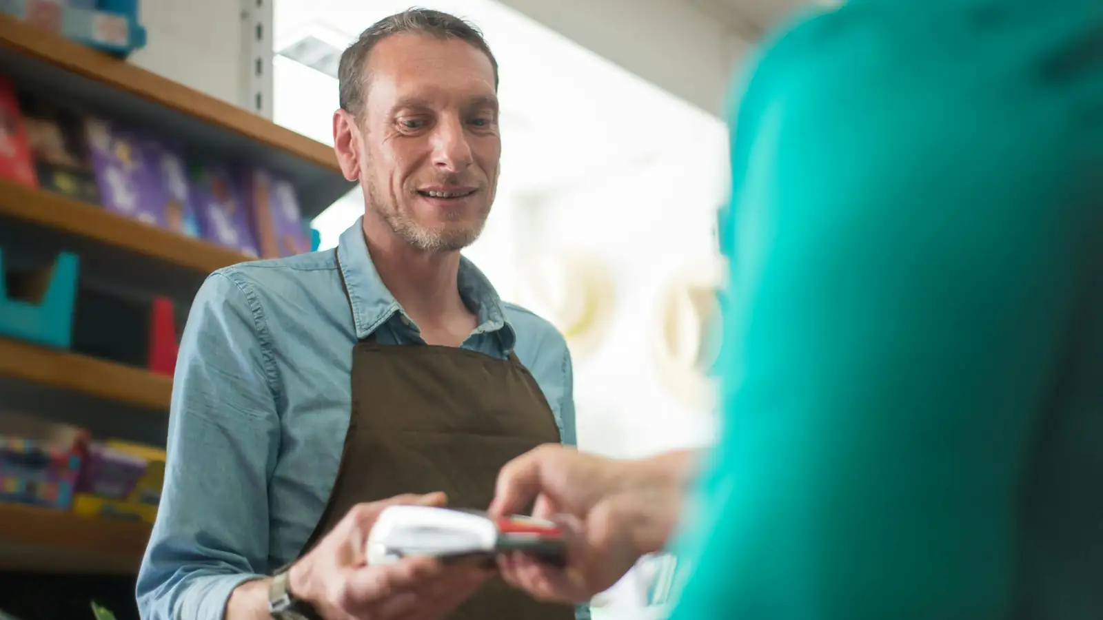 Toy store employee smiling